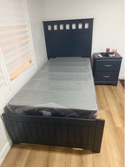 bed with nightstand and box