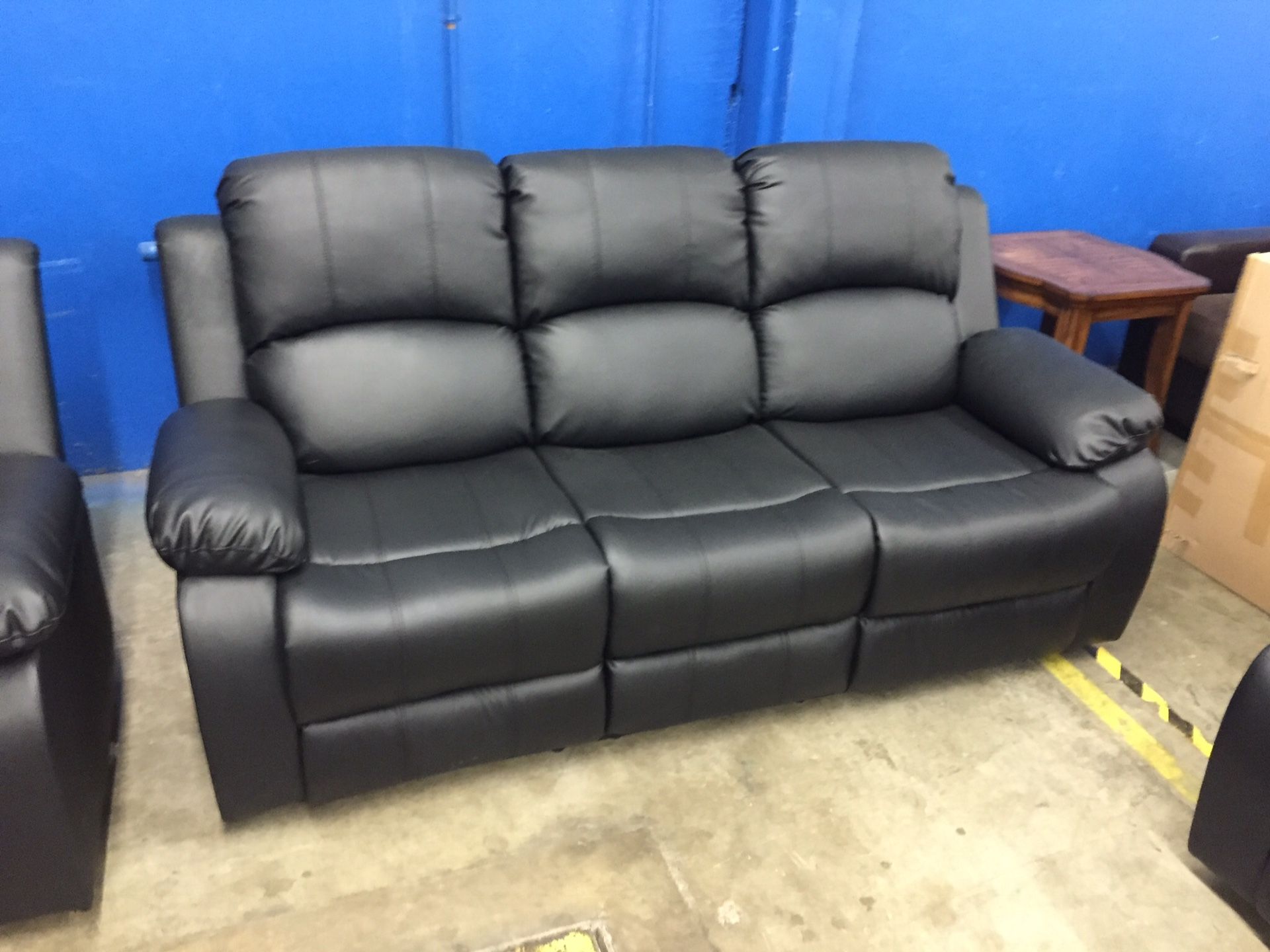 Black leather fully reclining sofa