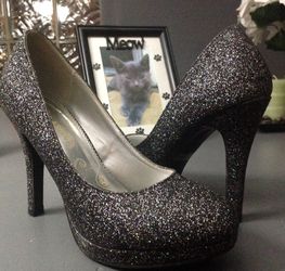 Black glittered high heels.