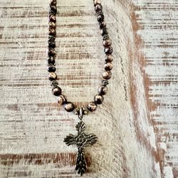 Tiger eye beaded necklace with sterling silver cross measures at 15 inches