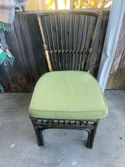 Dark Rattan Chair with Green Cushion