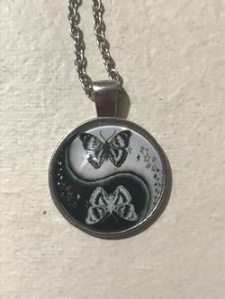 Butterfly/yin yang charm necklace