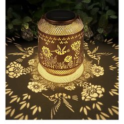 Hummingbird solar lanterns outside