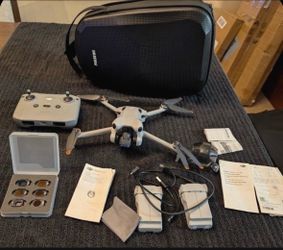 DJI Mini 4 Pro Fly More Kit Drone w/ RC-N1, 2 Batteries, Case, and ND Filters