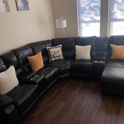  large black leather, sectional reclining, with 4 cups holder, 2 storage