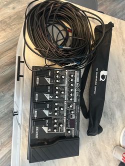 Guitar pedal with guitar cables and music stand