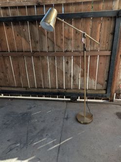 Brass colored floor lamp