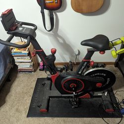Spin Bike, Floor Mat, And Heart Rate Monitor 