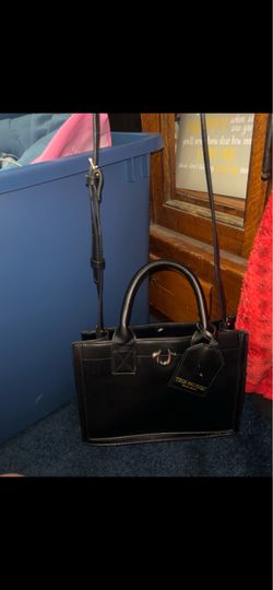 This True Religion Mini Logo Tote Bag in black features a distinctive silver horseshoe logo charm