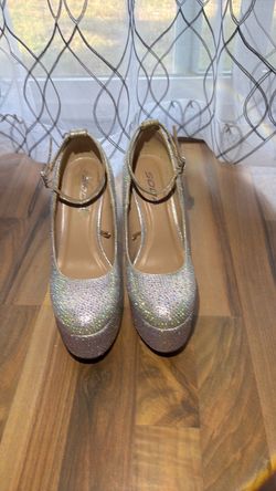 Sparkling silver platform pumps .