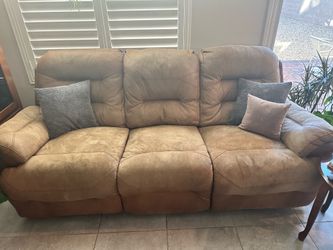 2 brown/tan leather couches