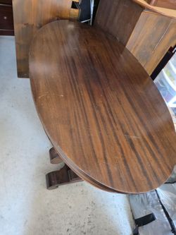 Dark Wood Round Table with Scroll Base