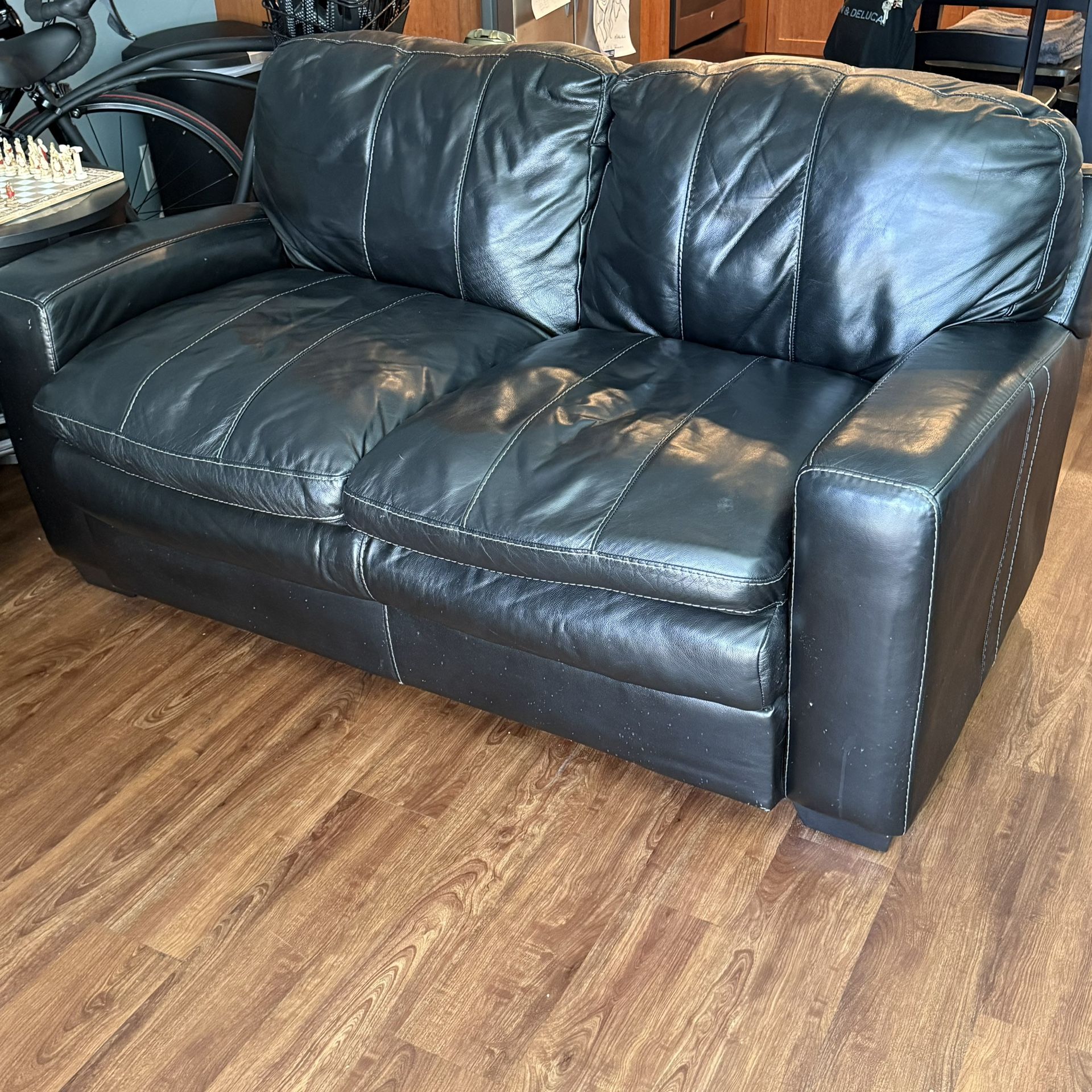 Black Leather Sofa – Seats 2 $200