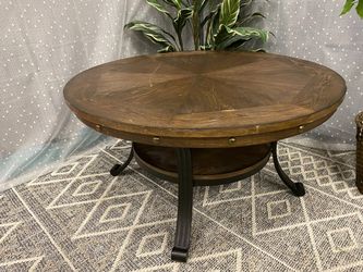 Dark Finish Round Wooden Coffee Table with Wrought Iron Base and Nailhead Trim