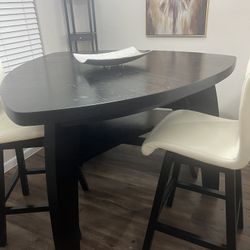 High Dining room table and two chairs and sofa sitting for table