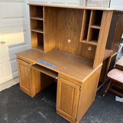 Large Wood Computer Desk with cabinets and shelf space.