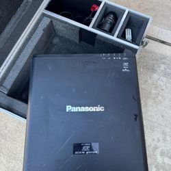 Panasonic PT-DZ870 Projector. Includes Road case And Two Lenses