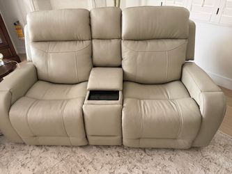 Massaging reclining sofa