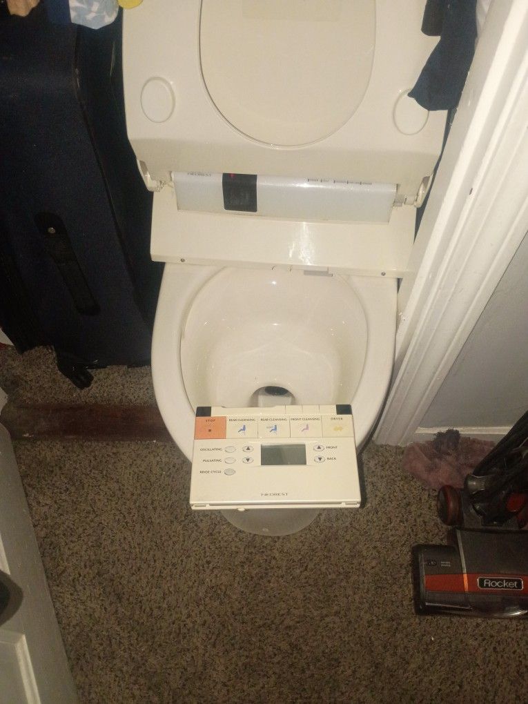 A Beadu Toilet Brand Name Toto.