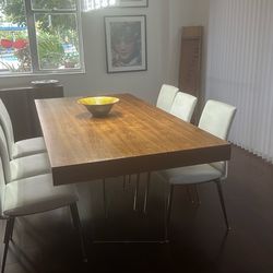 Moe’s solid wood dining table and 6 leather chairs