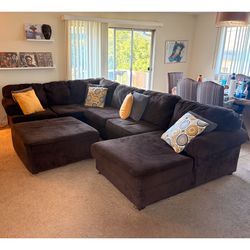 Dark brown corduroy sectional sofa with ottoman