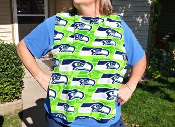 Seahawks man bibs.... eat with confidence!!! These Are So Cool Because They Hold The Messes And Then Just Washes Away!! 