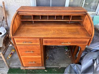 Solid wood desk recently restrained .good to fair condition