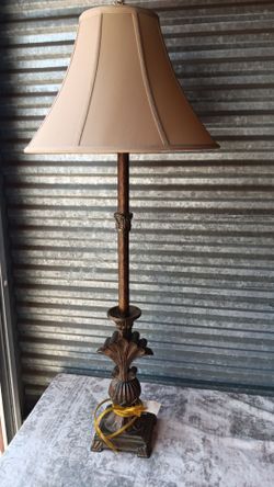 This is a large ornate traditional/Baroque-style floor lamp with an antique bronze/aged-gold finish. The base has a highly decorative acanthus-leaf an