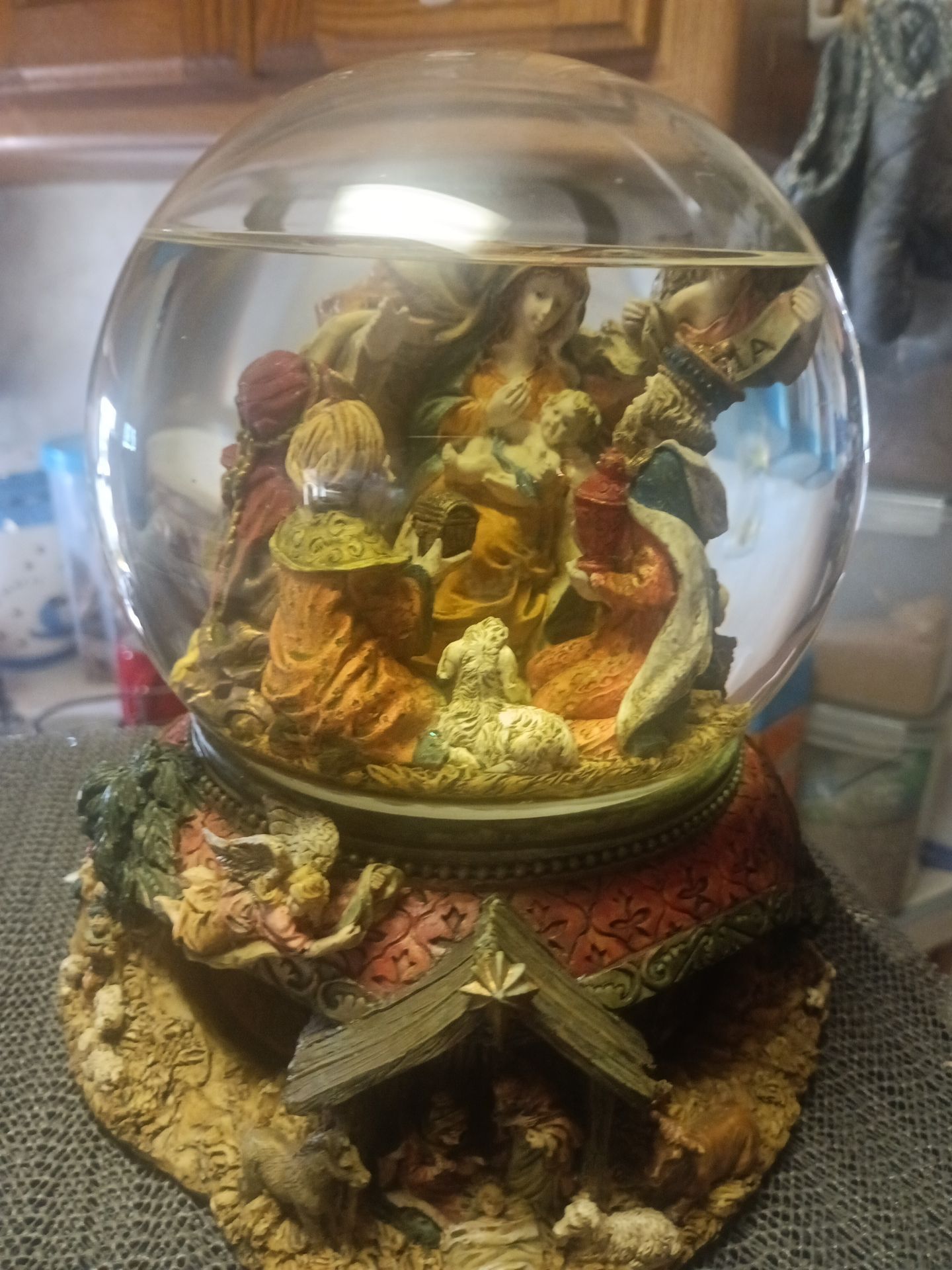 Kirkland signature water globe with revolving base Christmas snow globe for sale.