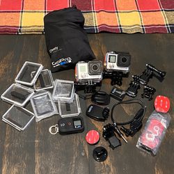 2 GoPros (Hero 4 and Hero 3) With Chest Harness And Other Accessories