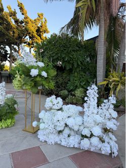 Luxury wedding floral arrangement with gold stands