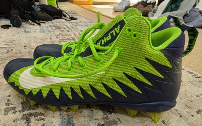 Neon green and dark blue Nike Alpha Menace Football cleats