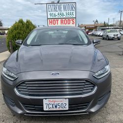 2014 Ford Fusion. . Clean Title  . Excellent Condition  . We Finance 