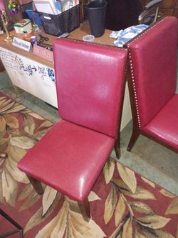 Set of 4 nice leather burgundy chairs with edging studs