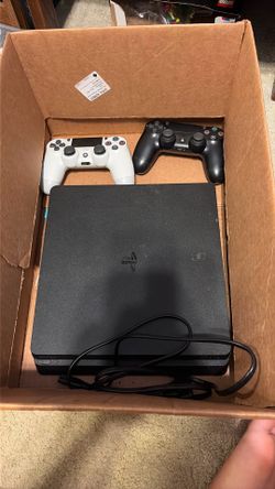 PS4 with controllers and 2 games