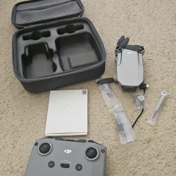 DJI Mavic Mini 2 Drone with case. Comes with battery and controller, cable and spare propeller