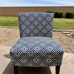 Beautiful blue and white accent chair with studed base