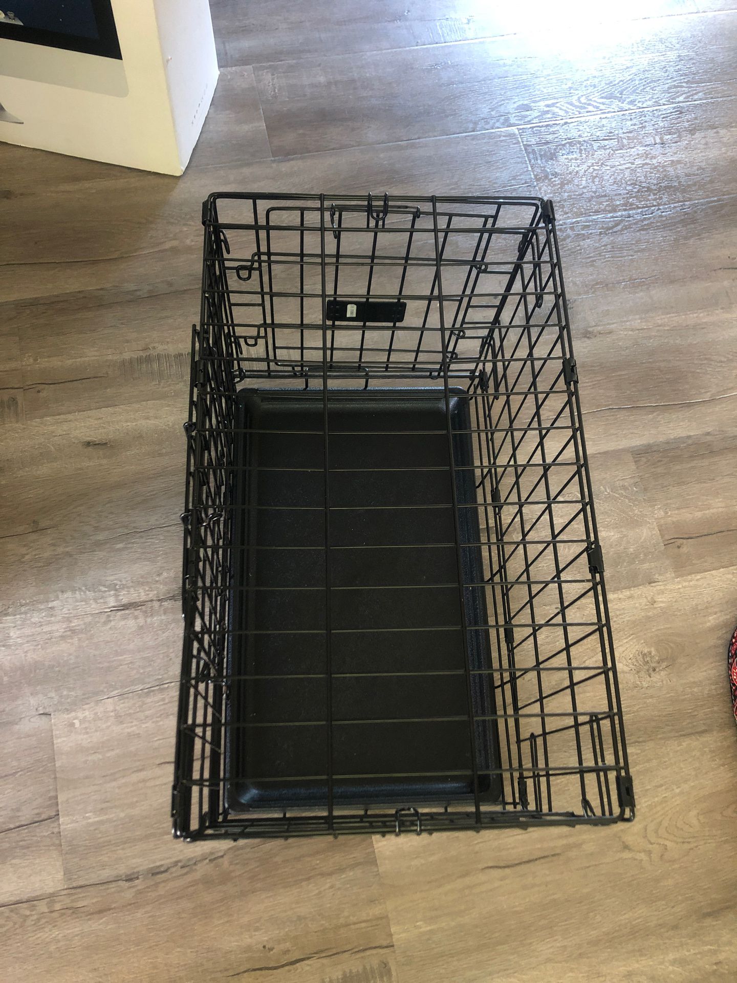 Small dog crate with some accessories