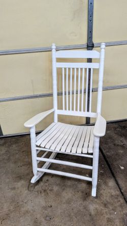 White wooden rocking chair.
