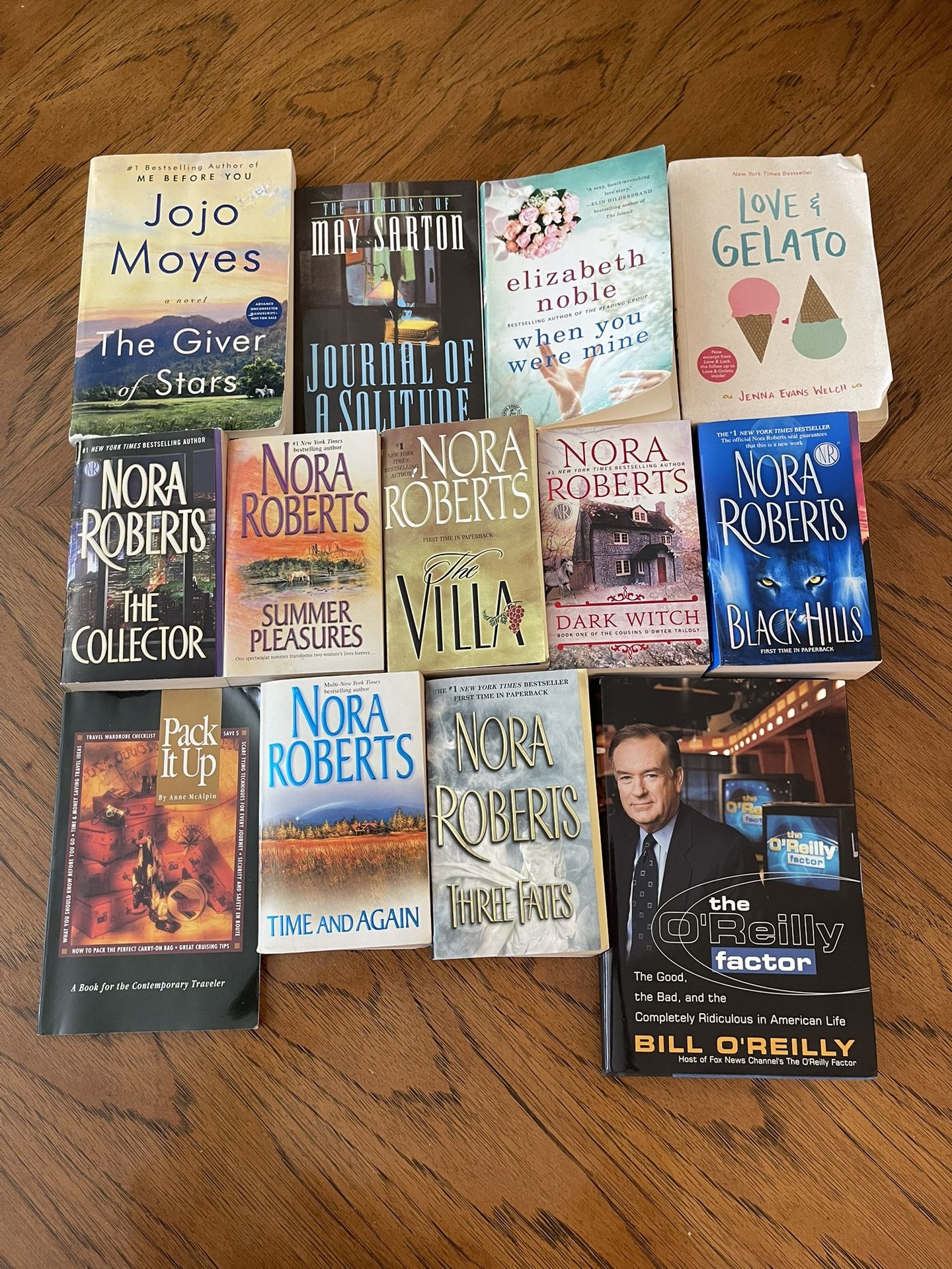 Random Lot of 13 Books - Mostly Paperback Novels - Nora Roberts, Etc. Also includes a Travel Book & a Bill O’Reilly Book