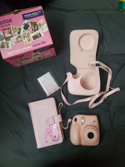 Fujifilm Instax Mini 7+ pink instant camera bundle with accompanying film and photo accessories