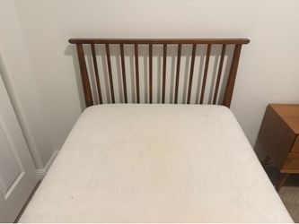 Two mid century twin beds with mattresses