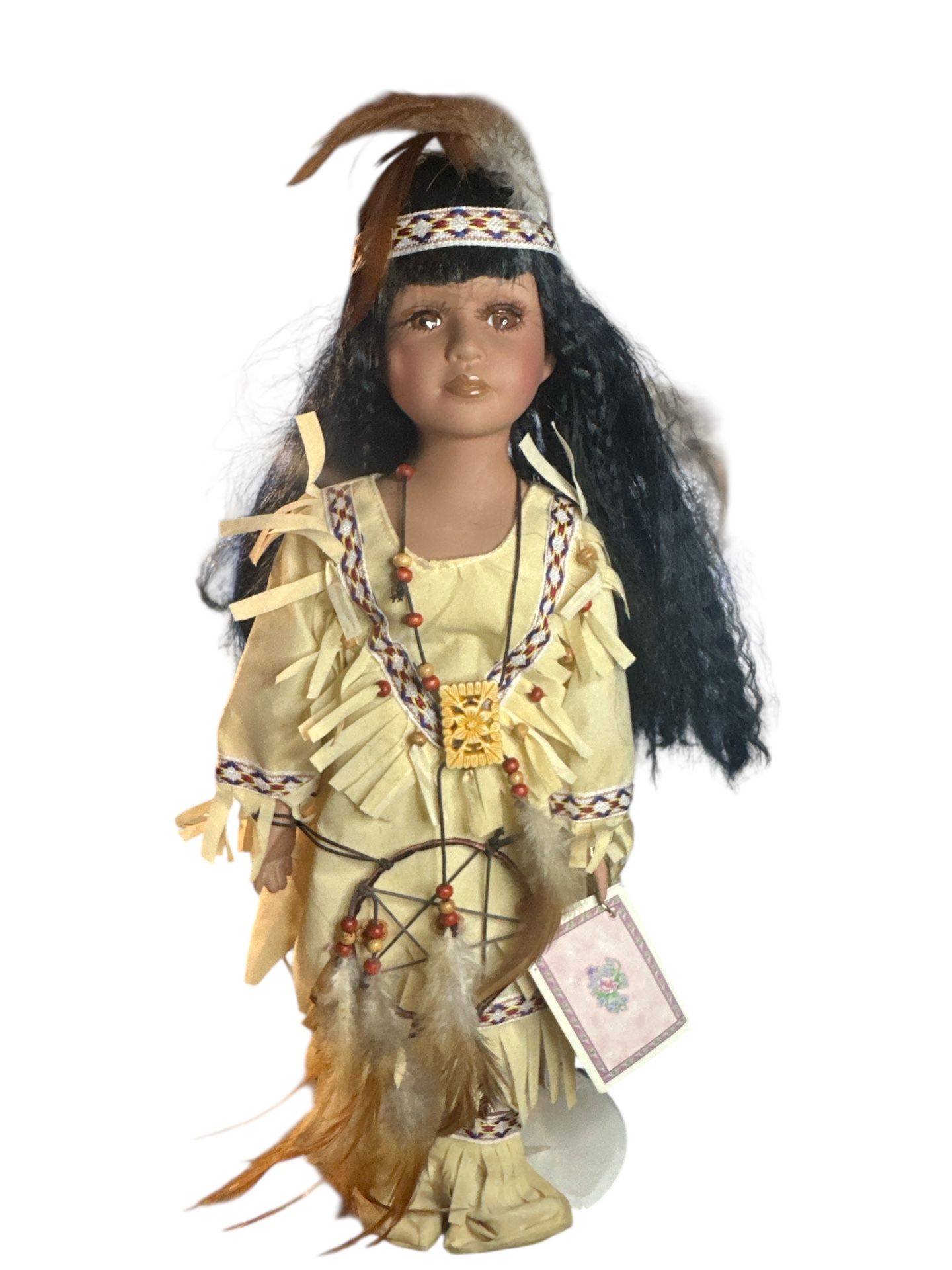 Induma is a collectible Native American Porcelain Doll. 16" in height standing.( comes with doll stand) Porcelain head,hands,and feet,wears a beautifu