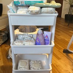 Caddy With Newborn Diapers. Opened Package Of Swimmers And Baby Wash And Cream Wipes.  All For $30.00