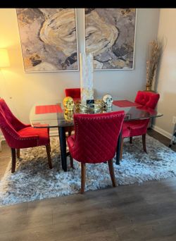 Red chairs and glass table