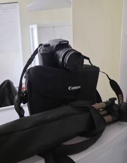 Canon Rebel T6 DSLR Starter Bundle - Tripod, Case & Extra Batteries Included!