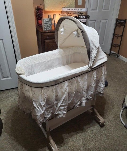 Delta Children Rocking Bedside Bassinet - Portable Crib with Lights Sounds and Vibrations, Play Time Jungle