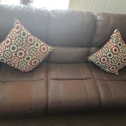 Two reclining leather sofas 