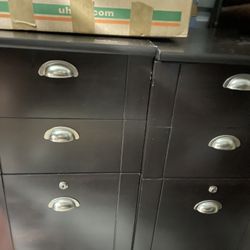 Two separate file cabinets, two small drawers, each and one full size hanging folder drawers with key locks. Each one is 15 inches wide 22 inches deep