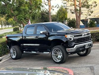 Tuff 24x14 Chrome Rims & 35" Venom Power Tires Set + Spacers